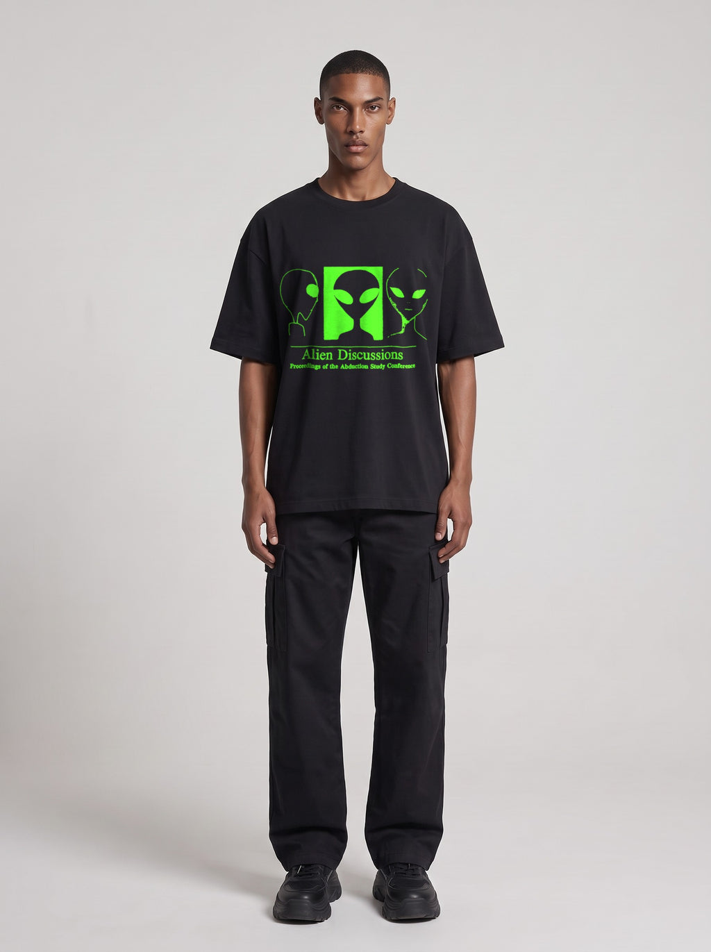 Alien Discussions Neon — Drop Shoulder T-Shirt in Black Beauty, front, worn by male model