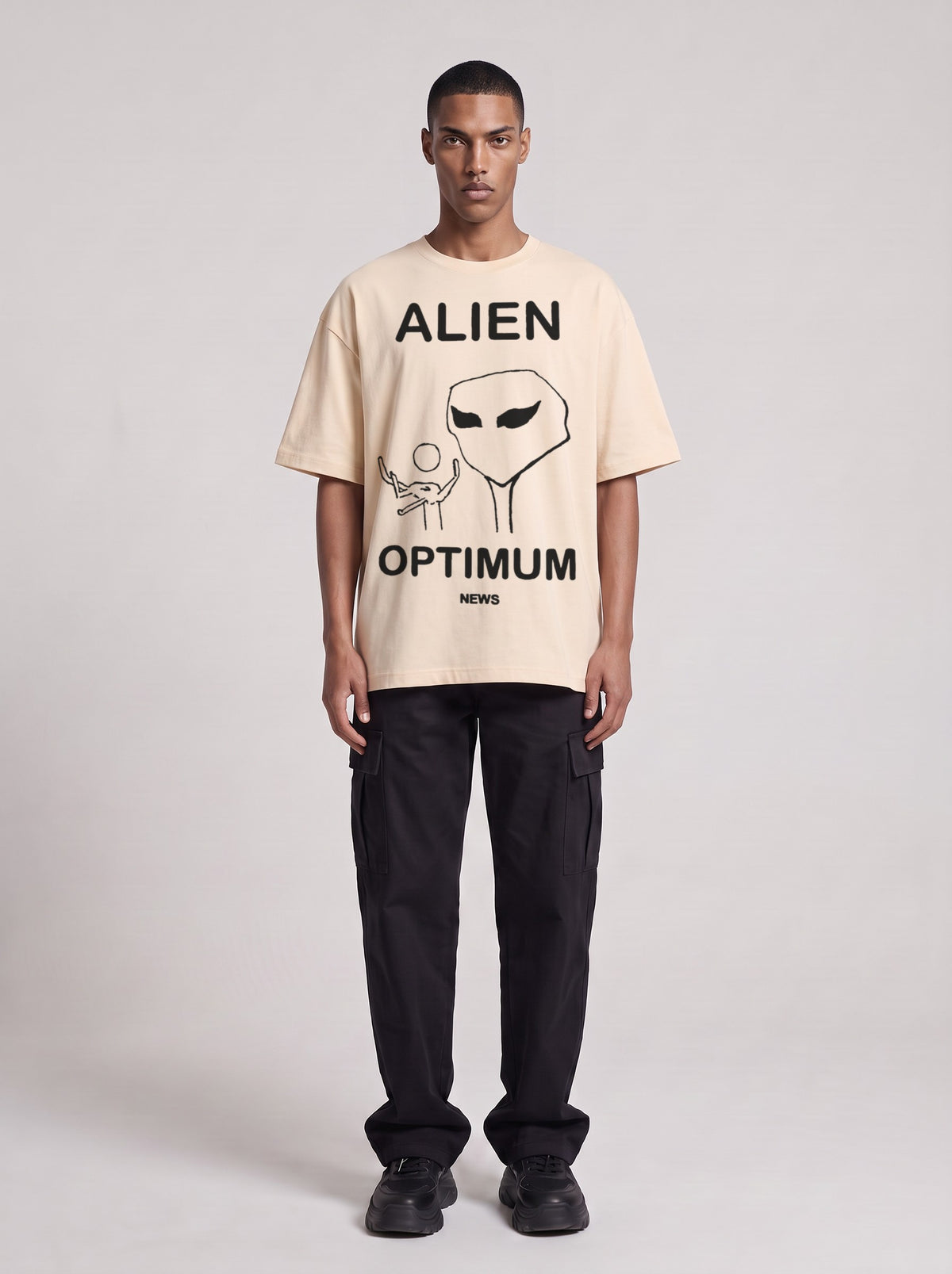 Alien Optimum — Drop Shoulder T-Shirt in Light Apricot, front, worn by male model