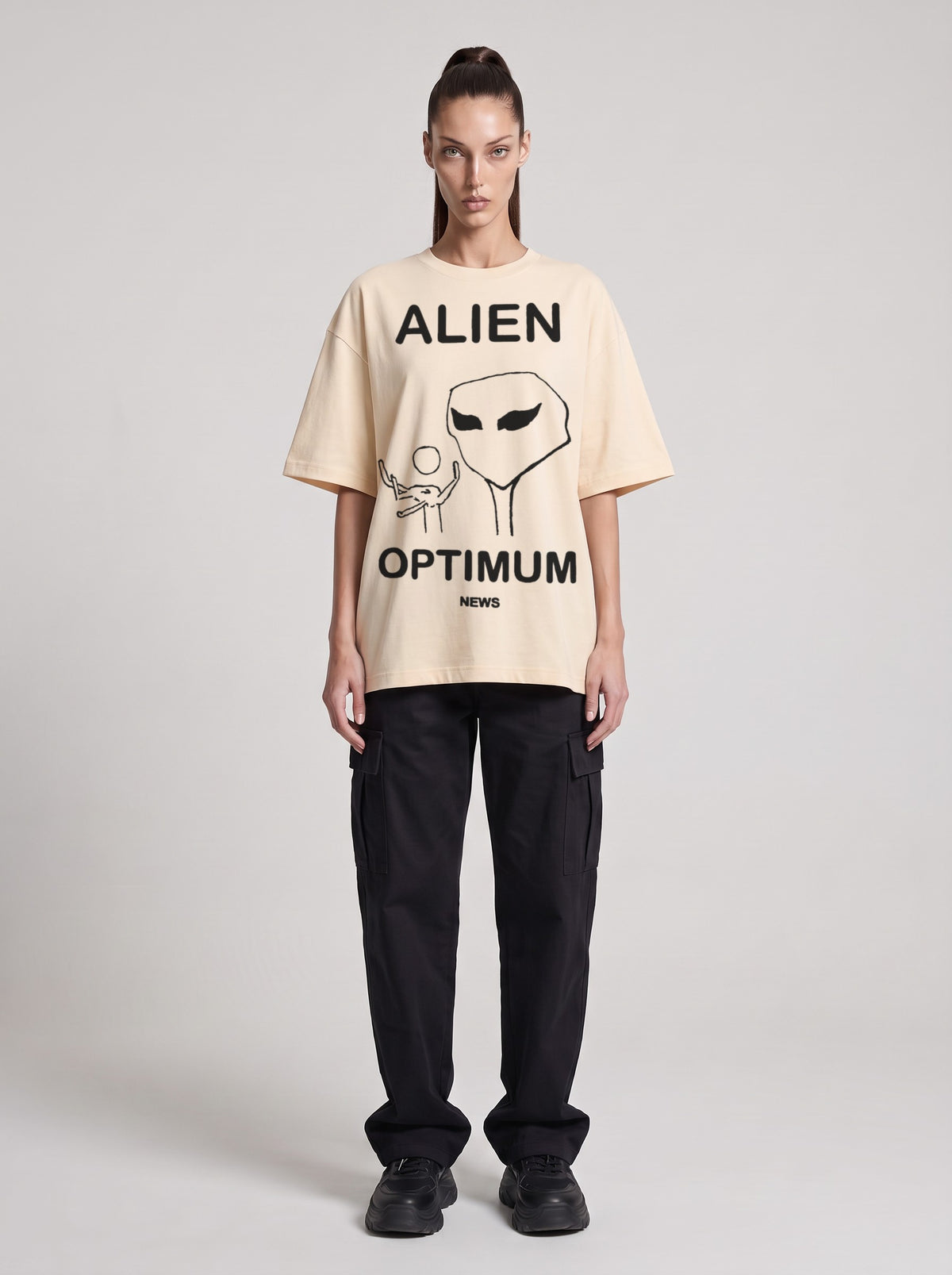 Alien Optimum — Drop Shoulder T-Shirt in Light Apricot, front, worn by female model
