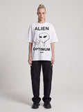 Alien Optimum — Drop Shoulder T-Shirt in White, front, worn by female model