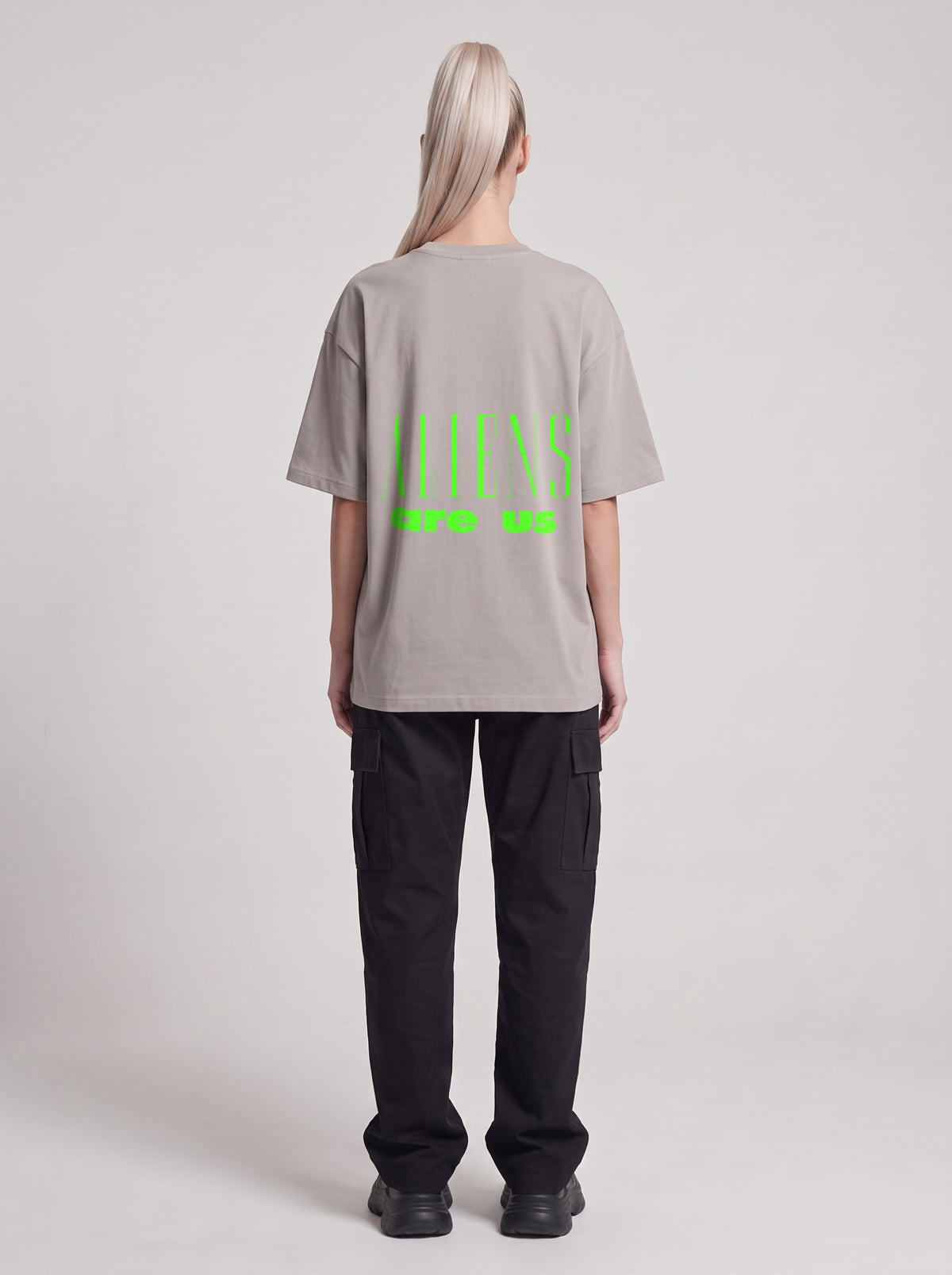 Aliens Are Us Neon — Drop Shoulder T-Shirt in Light Gray, back, worn by female model