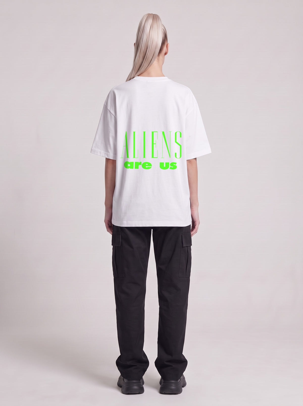 Aliens Are Us Neon — Drop Shoulder T-Shirt in Lucent White, back, worn by female model
