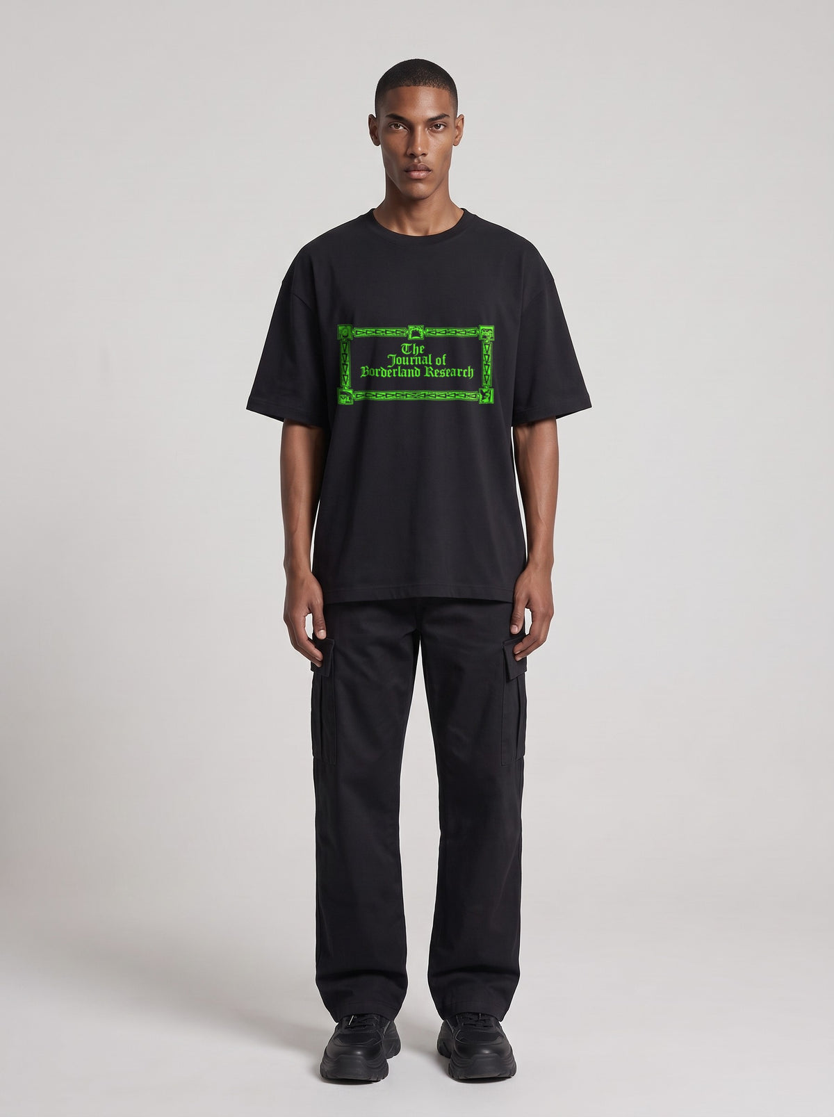 Borderland Research Neon — Drop Shoulder T-Shirt in Black Beauty, front, worn by male model