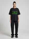Borderland Research Neon — Drop Shoulder T-Shirt in Black Beauty, front, worn by female model