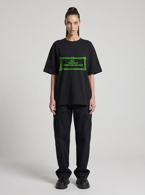 Borderland Research Neon — Drop Shoulder T-Shirt in Black Beauty, front, worn by female model