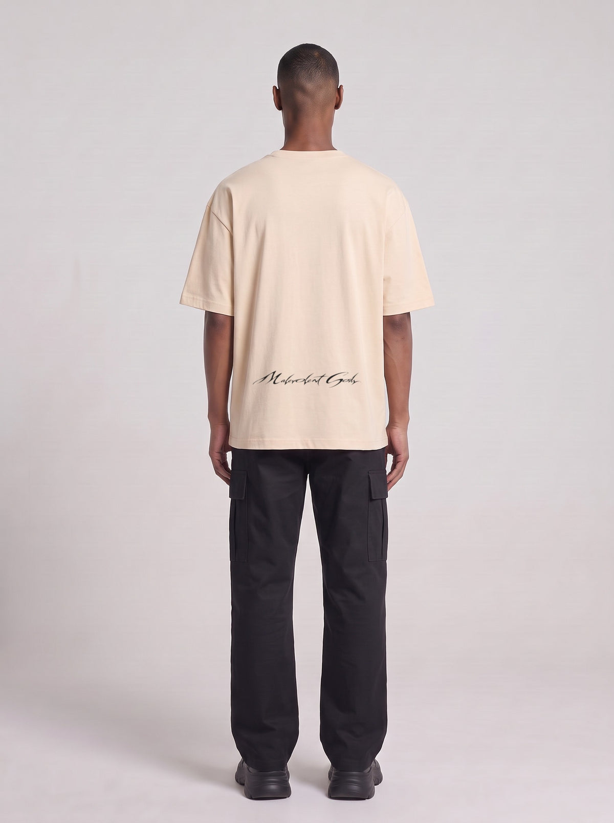 Borderland Research — Drop Shoulder T-Shirt in Light Apricot, back, worn by male model