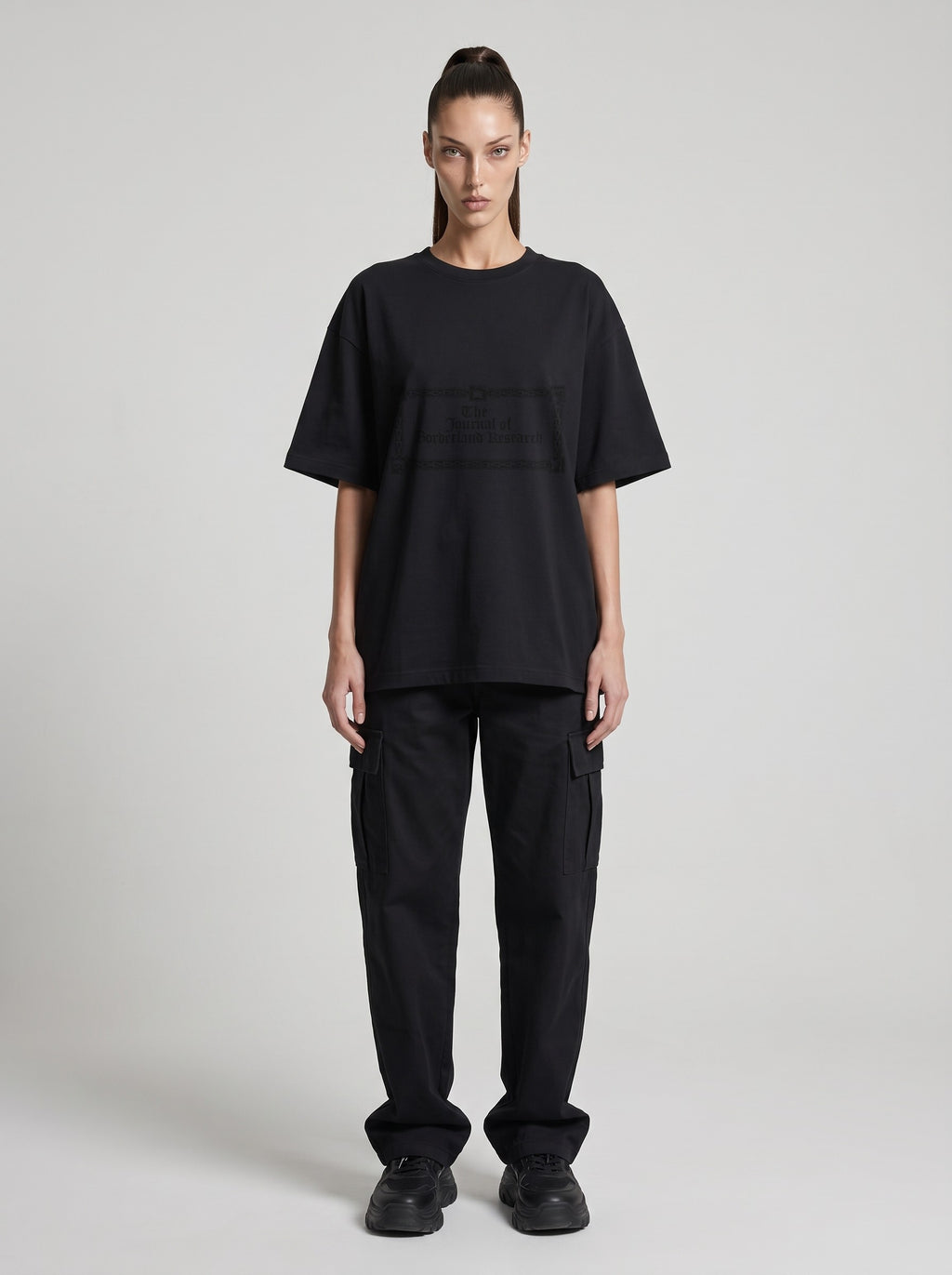 Borderland Research — Drop Shoulder T-Shirt in Black Beauty, front, worn by female model
