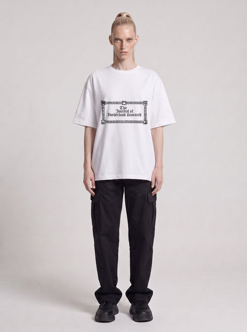 Borderland Research — Drop Shoulder T-Shirt in Lucent White, front, worn by male model