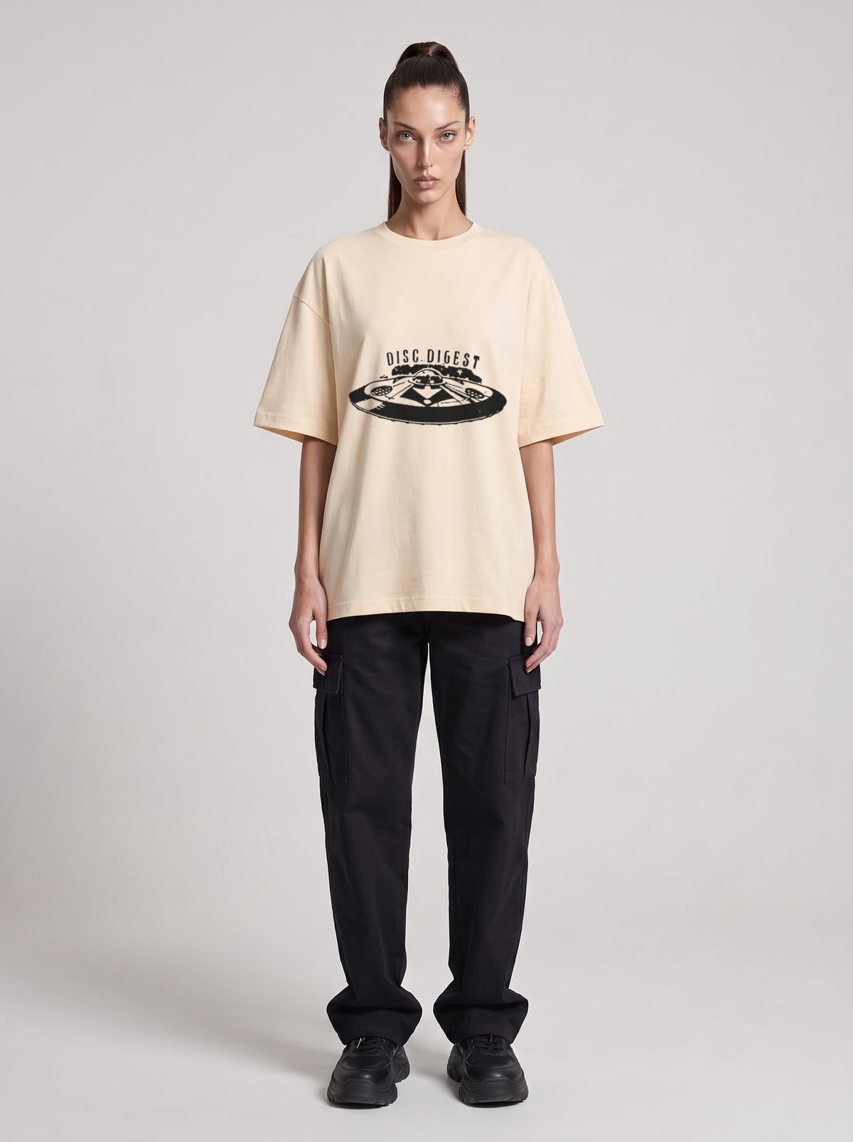 Disc Digest — Drop Shoulder T-Shirt in Light Apricot, front, worn by female model