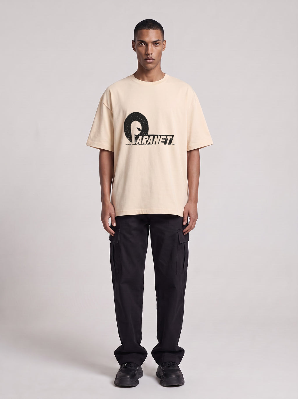 Paranet — Drop Shoulder T-Shirt in Light Apricot, front, worn by male model