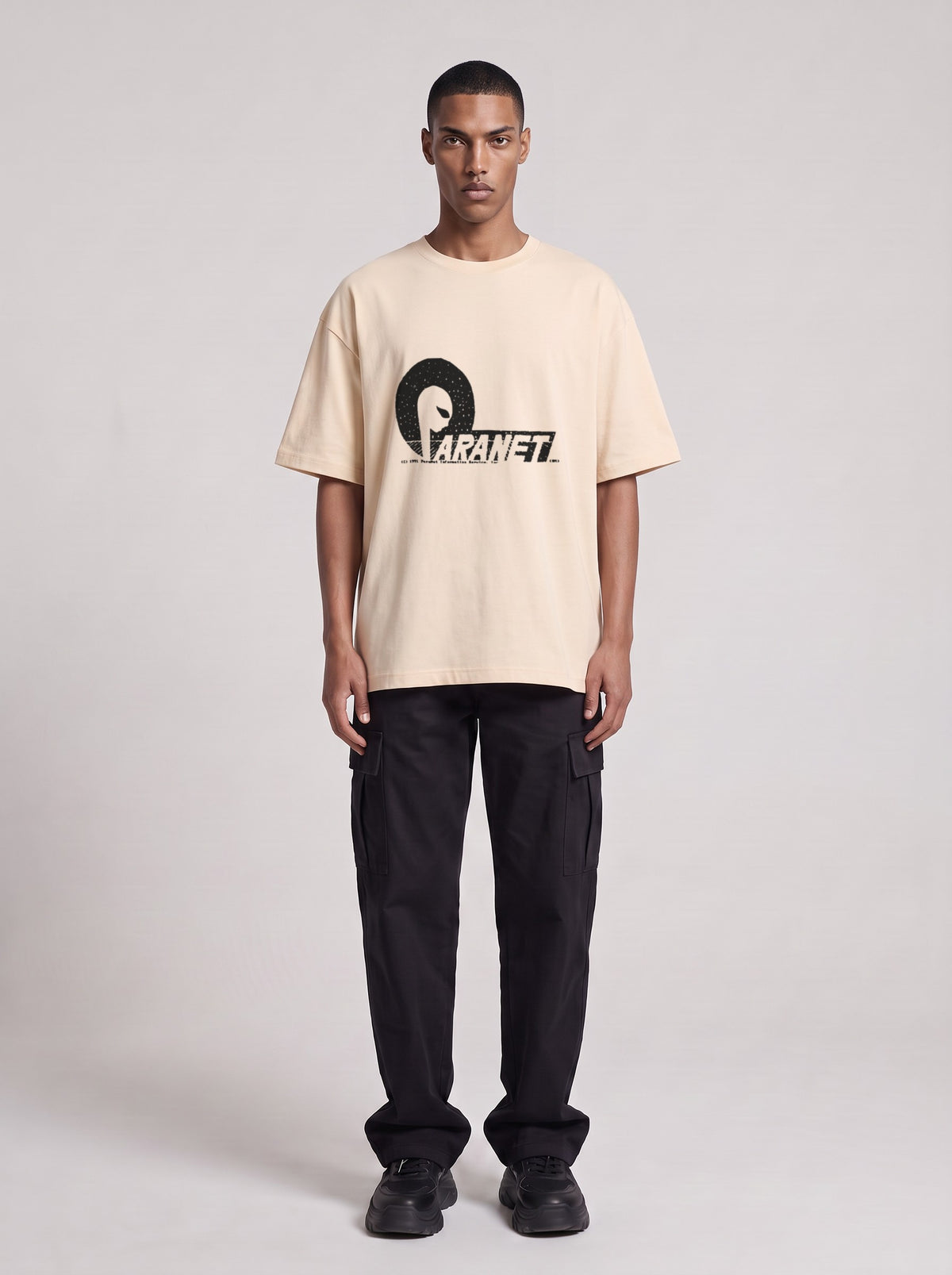 Paranet — Drop Shoulder T-Shirt in Light Apricot, front, worn by male model