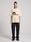 Paranet — Drop Shoulder T-Shirt in Light Apricot, front, worn by female model