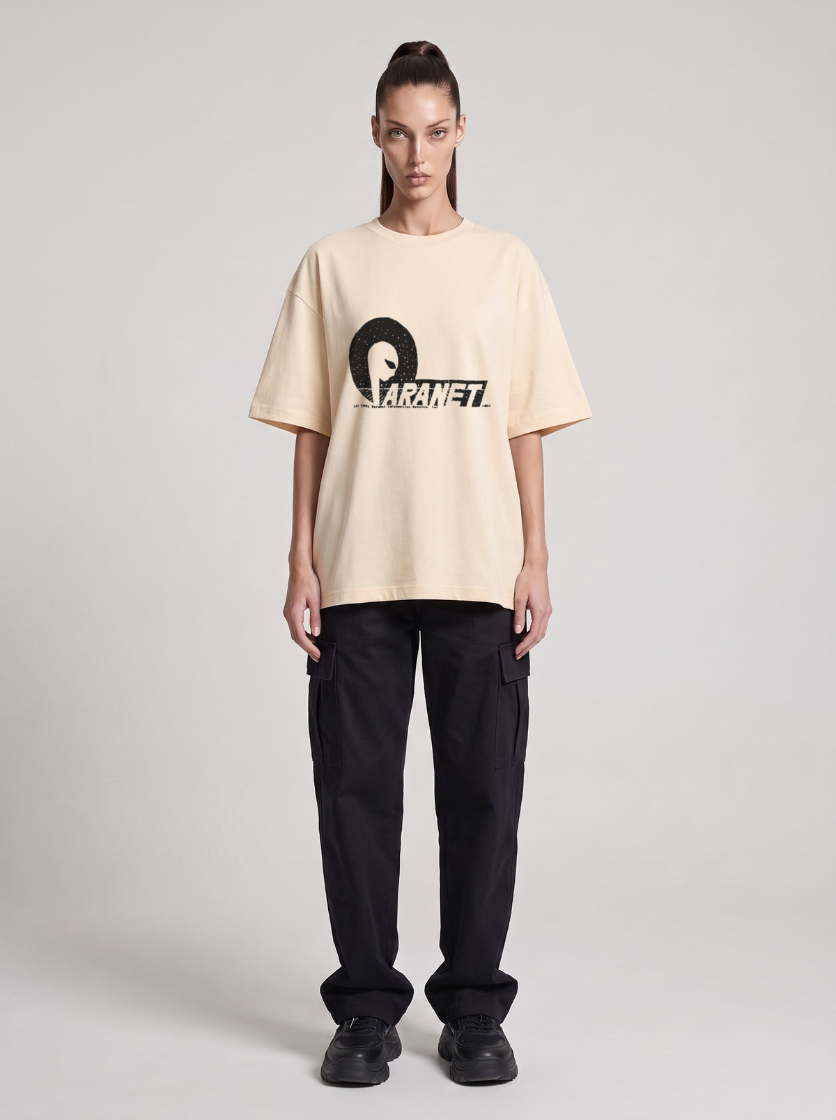 Paranet — Drop Shoulder T-Shirt in Light Apricot, front, worn by female model