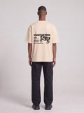 Paranormal Paradox — Drop Shoulder T-Shirt in Light Apricot, back, worn by male model