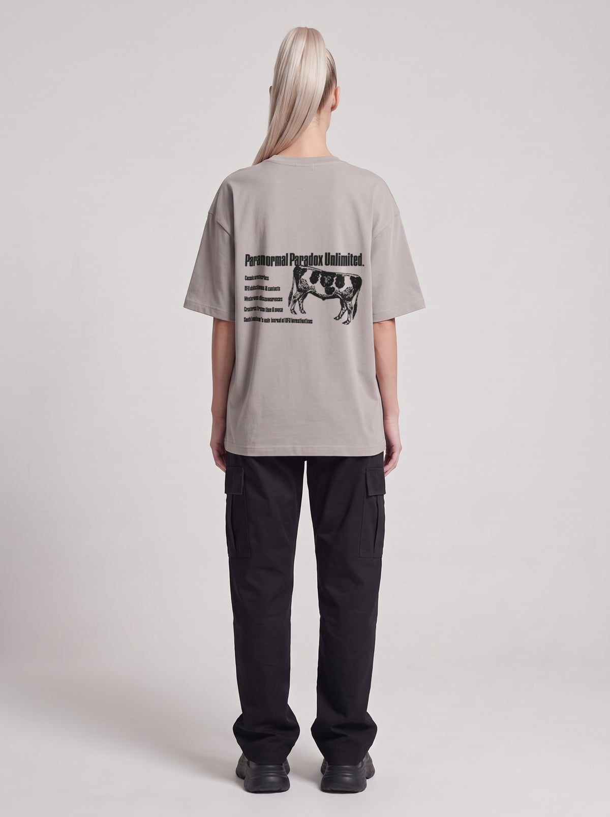 Paranormal Paradox — Drop Shoulder T-Shirt in Light Gray, back, worn by female model