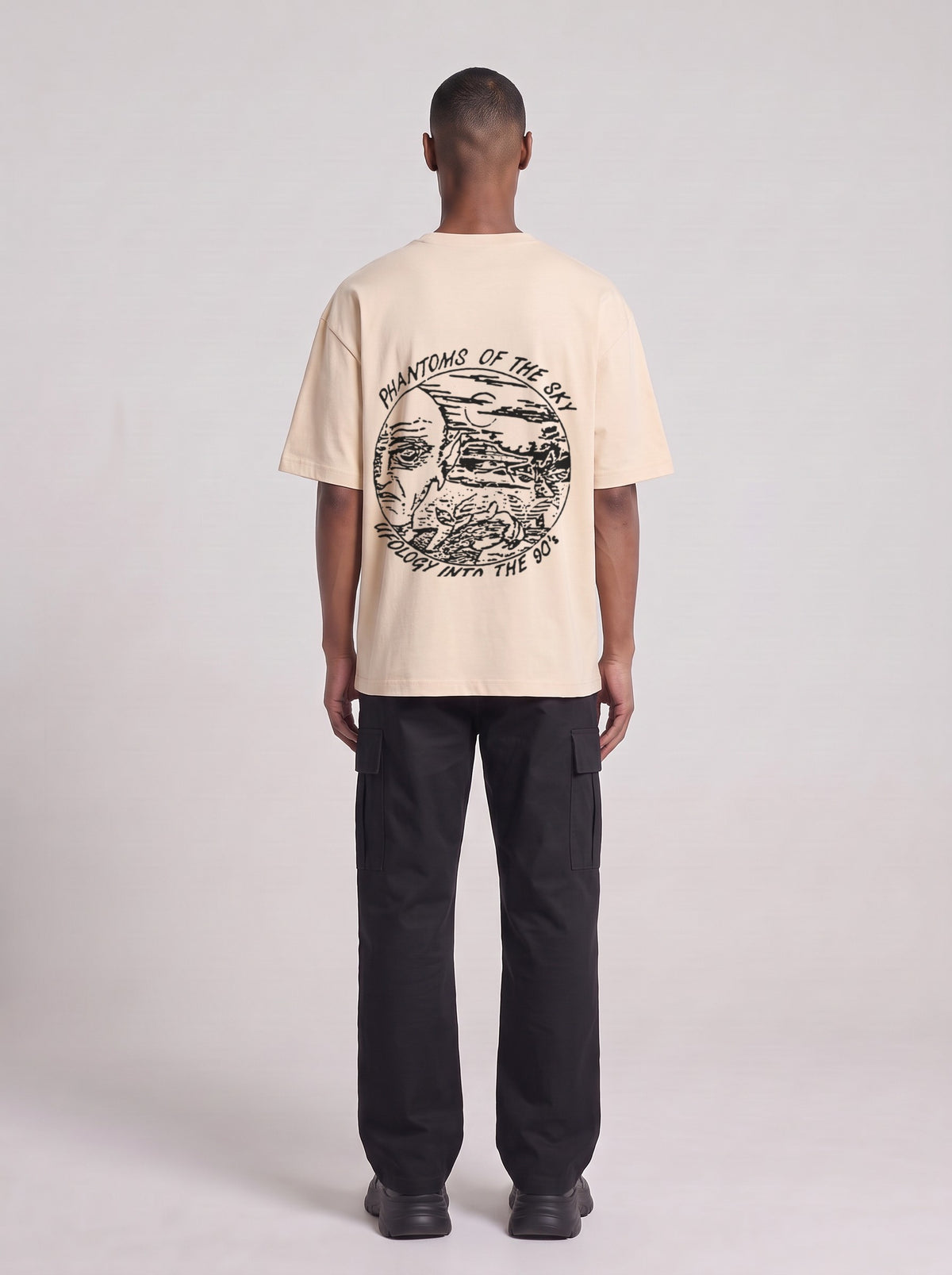 Phantoms of the Sky — Drop Shoulder T-Shirt in Light Apricot, back, worn by male model