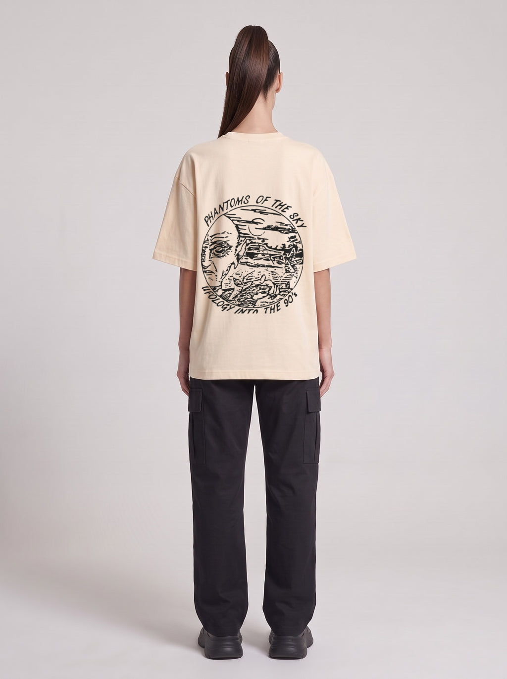 Phantoms of the Sky — Drop Shoulder T-Shirt in Light Apricot, back, worn by female model
