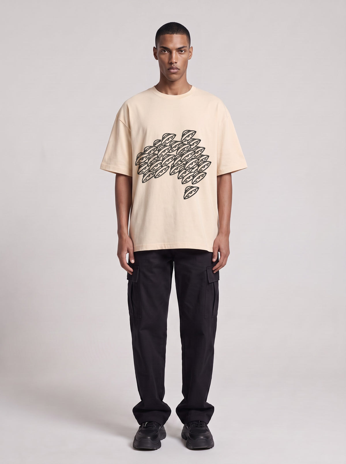 Saucer Fleet — Drop Shoulder T-Shirt in Light Apricot, front, worn by male model