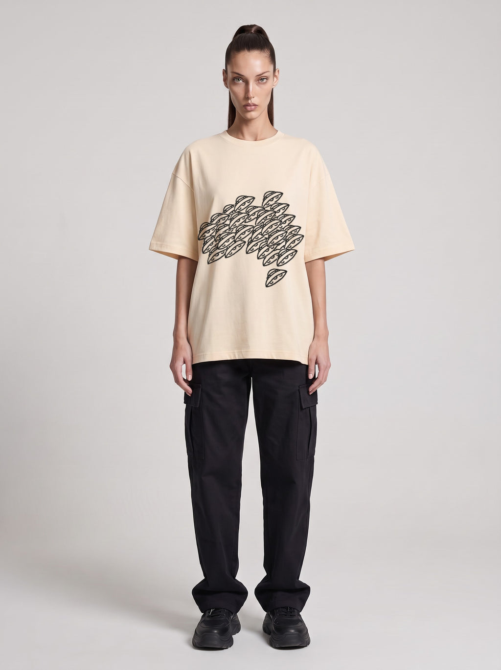 Saucer Fleet — Drop Shoulder T-Shirt in Light Apricot, front, worn by female model