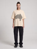 Saucer Fleet — Drop Shoulder T-Shirt in Light Apricot, front, worn by female model