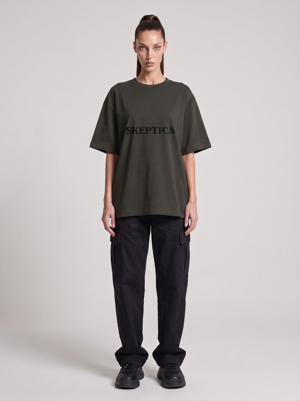 Skeptica — Drop Shoulder T-Shirt in Dark Gray, front, worn by female model