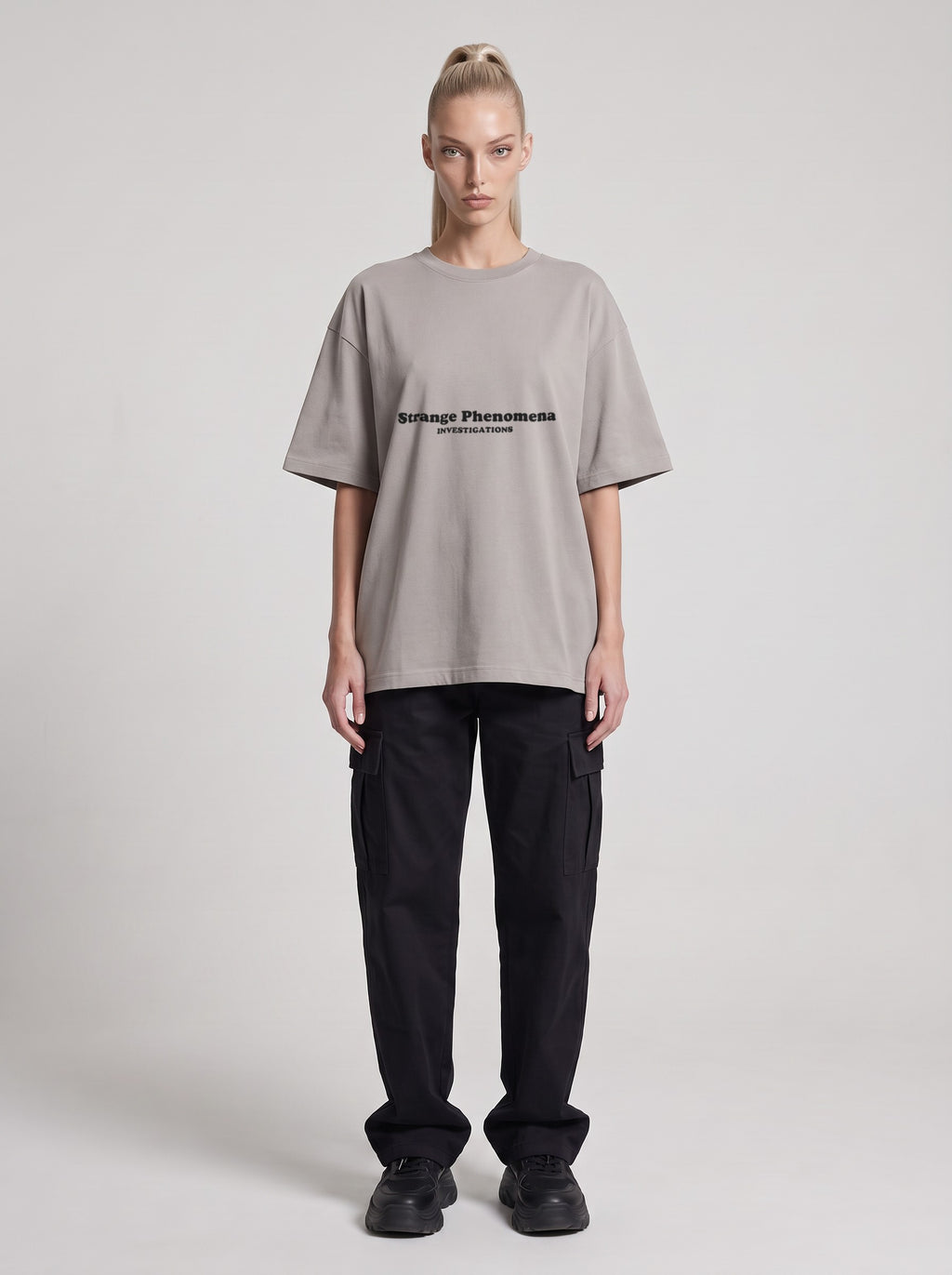 Strange Phenomena Investigations — Drop Shoulder T-Shirt in Light Gray, front, worn by female model