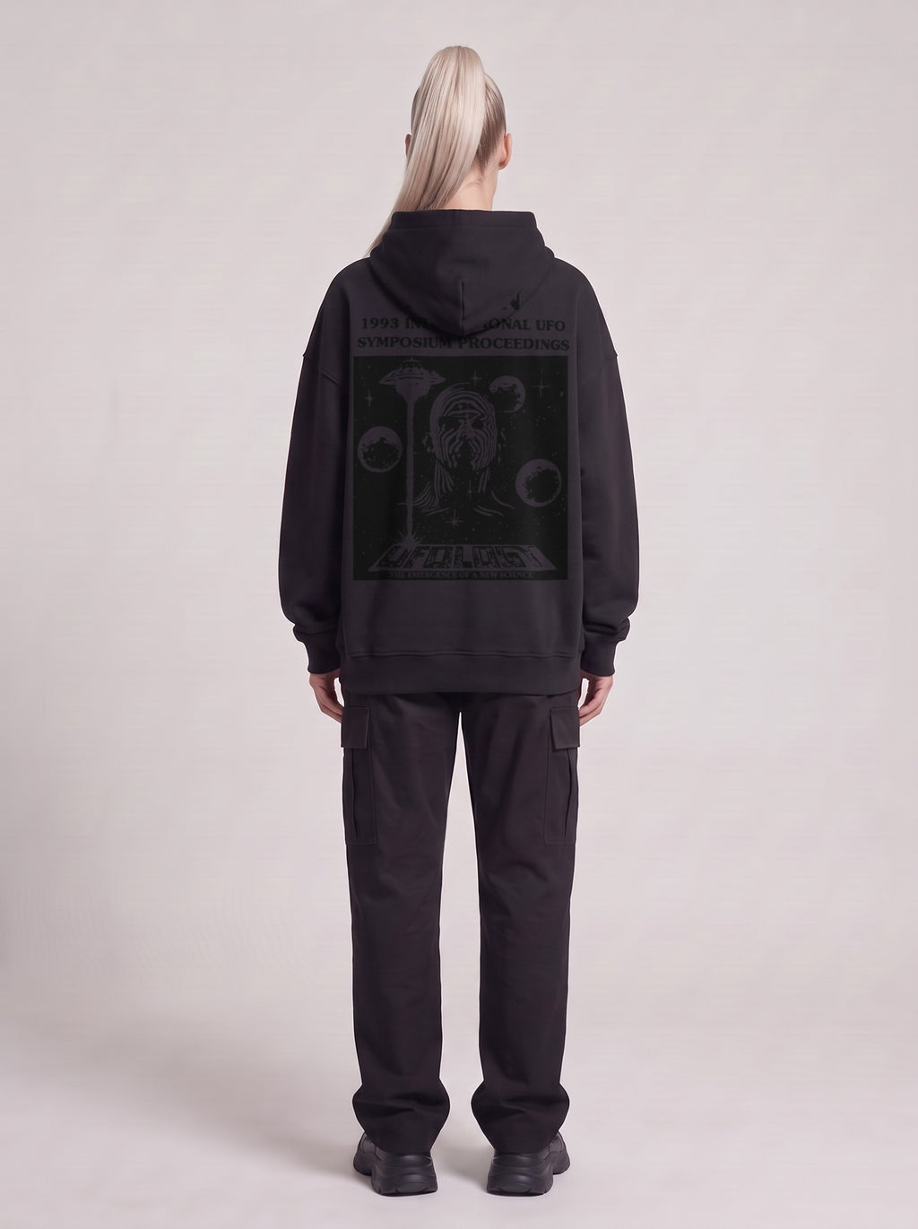 Symposium 1993 — Boxy Hoodie in Black, back, worn by male model