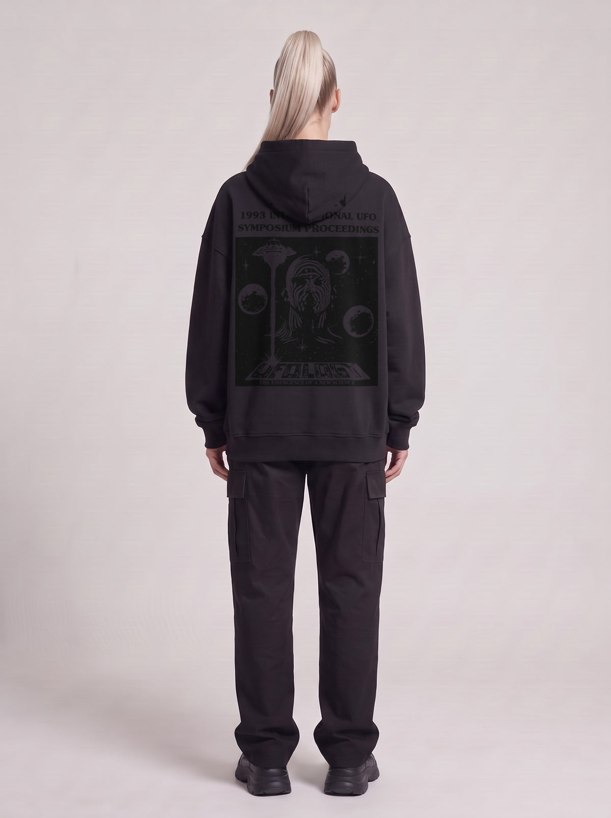 Symposium 1993 — Boxy Hoodie in Black, back, worn by male model