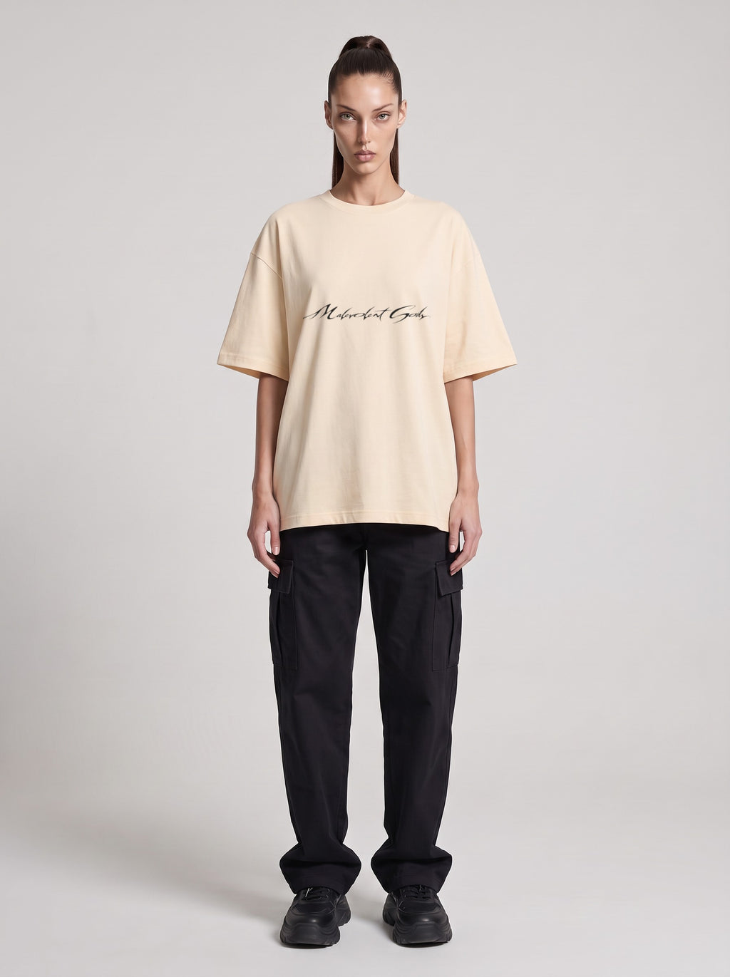 Symposium 1993 — Drop Shoulder T-Shirt in Light Apricot, front, worn by female model