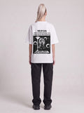 Symposium 1993 — Drop Shoulder T-Shirt in Lucent White, back, worn by female model