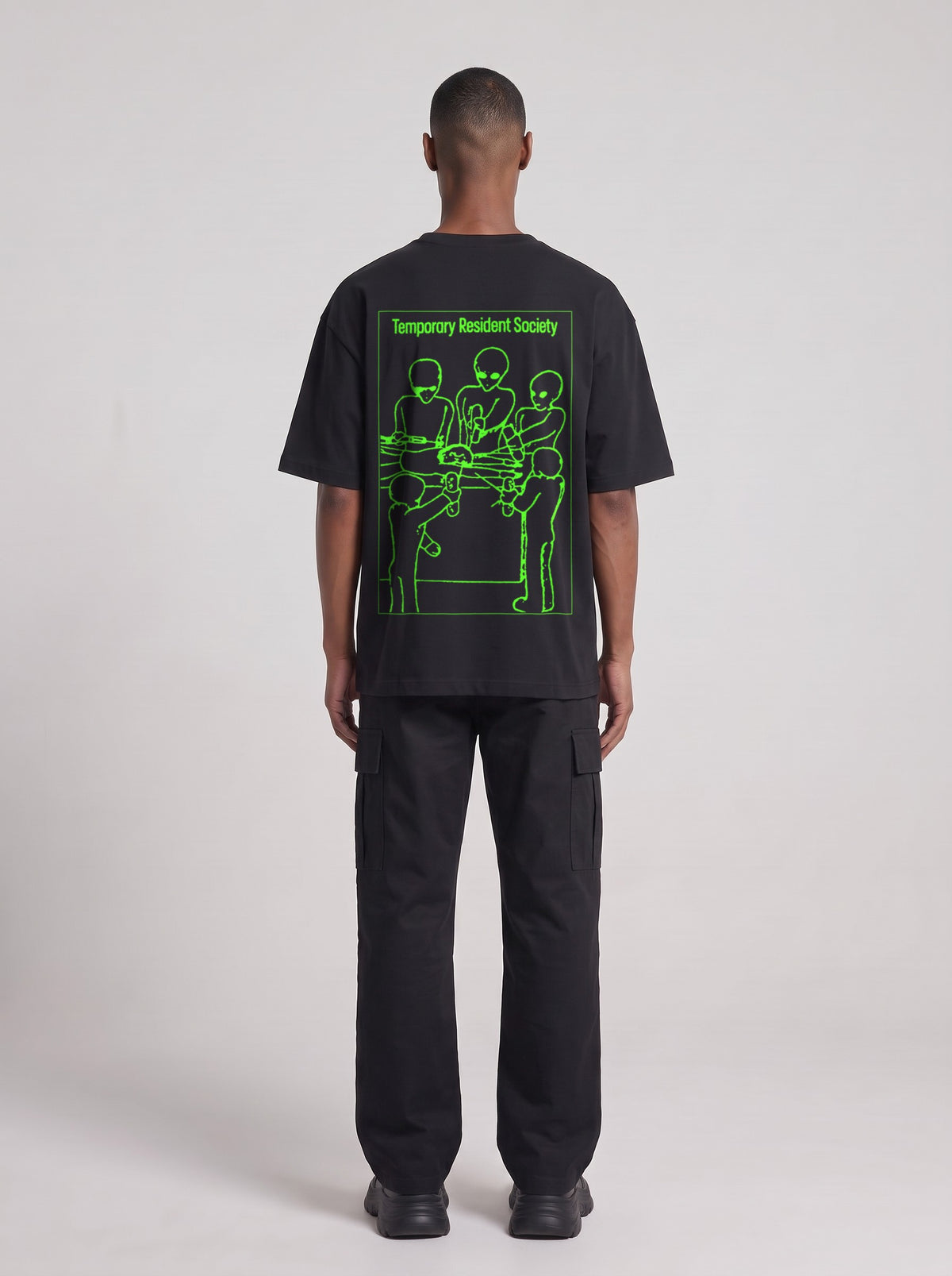 Temporary Resident Society Neon — Drop Shoulder T-Shirt in Black Beauty, back, worn by male model