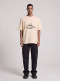 Vegas UFO Congress — Drop Shoulder T-Shirt in Light Apricot, front, worn by male model