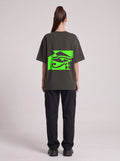 Watcher Neon — Drop Shoulder T-Shirt in Dark Gray, back, worn by female model